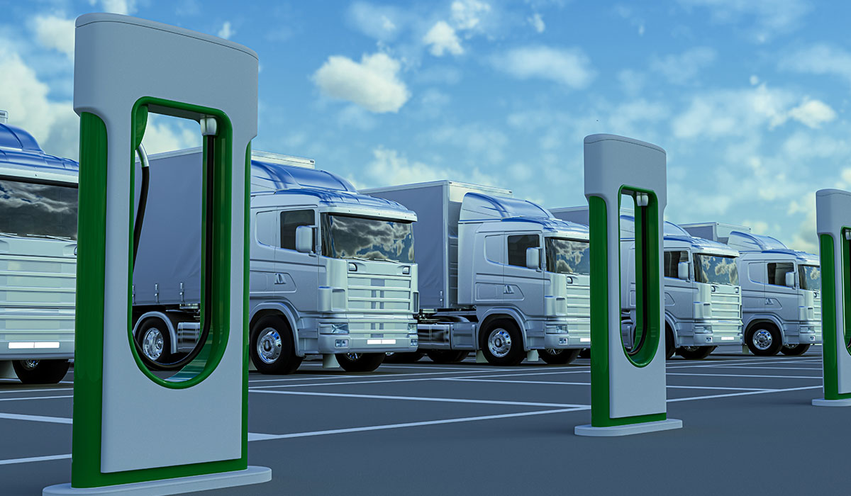 Electric trucks in charging station. Image credit: iStock